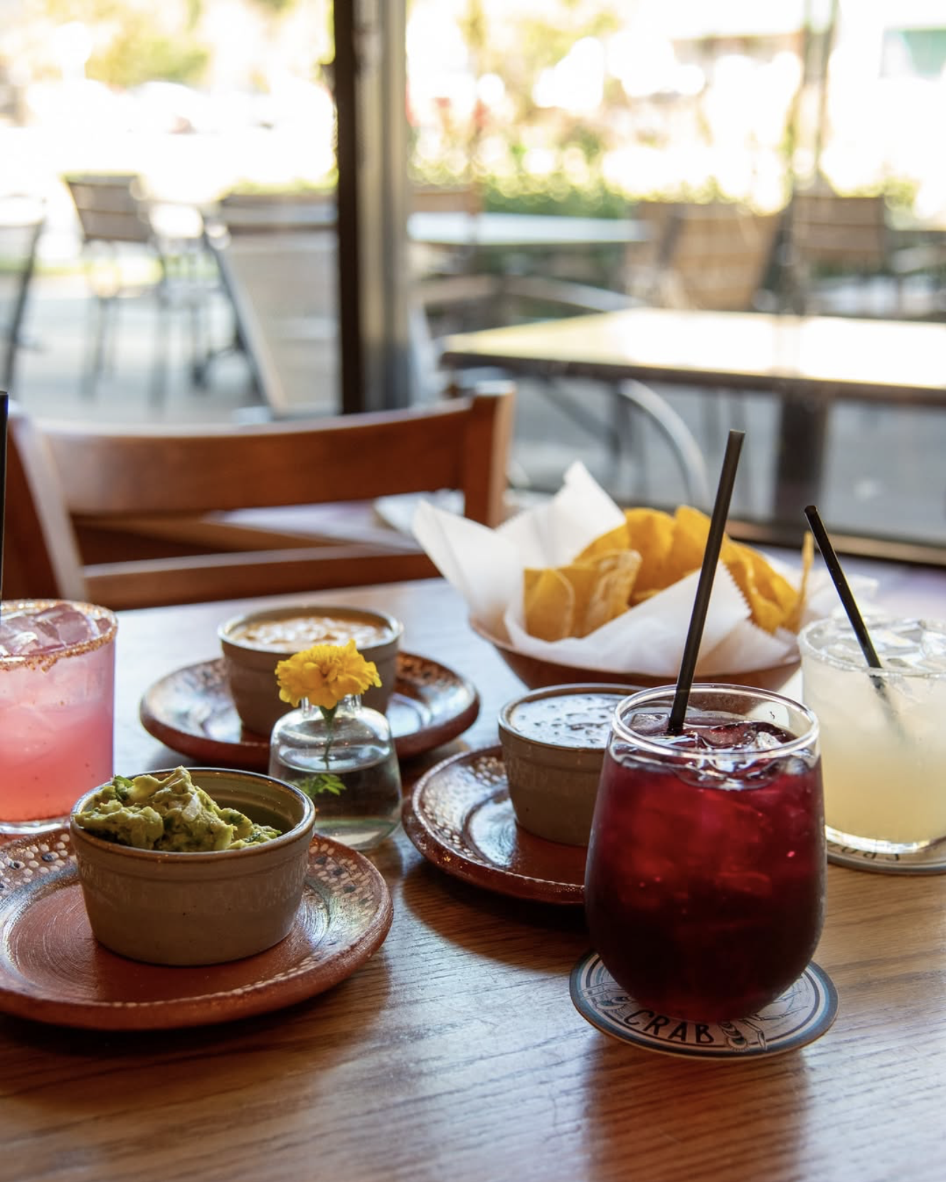 food and drinks and guacamole on table