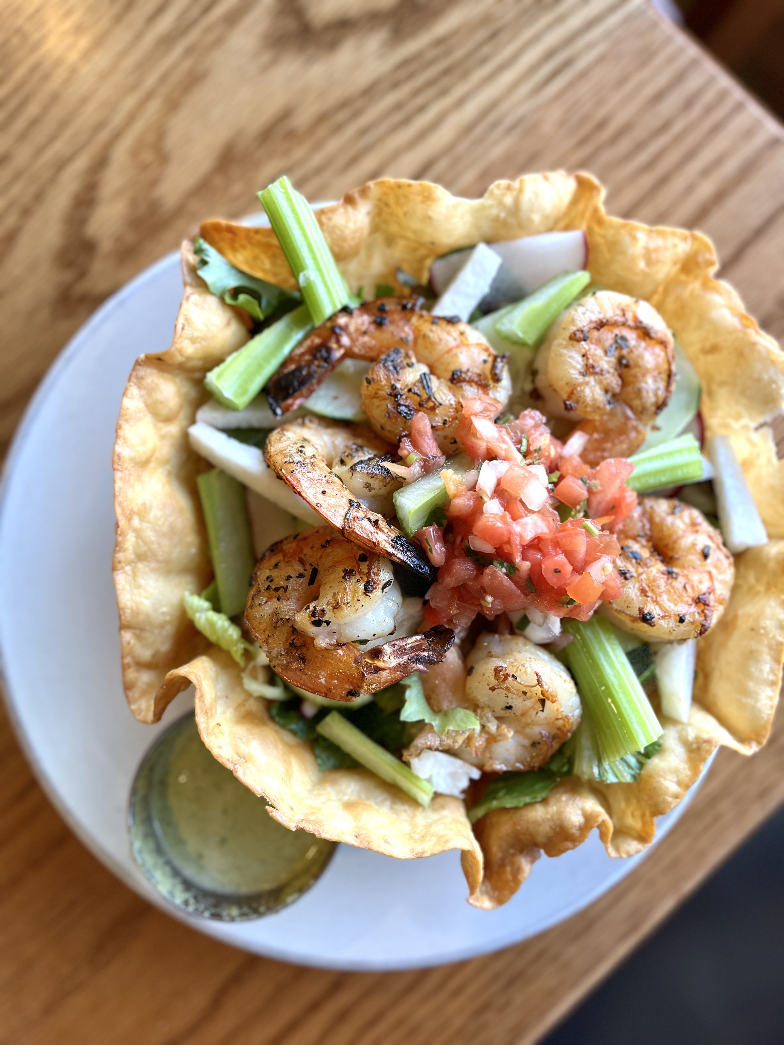 shrimp in a hard taco bowl