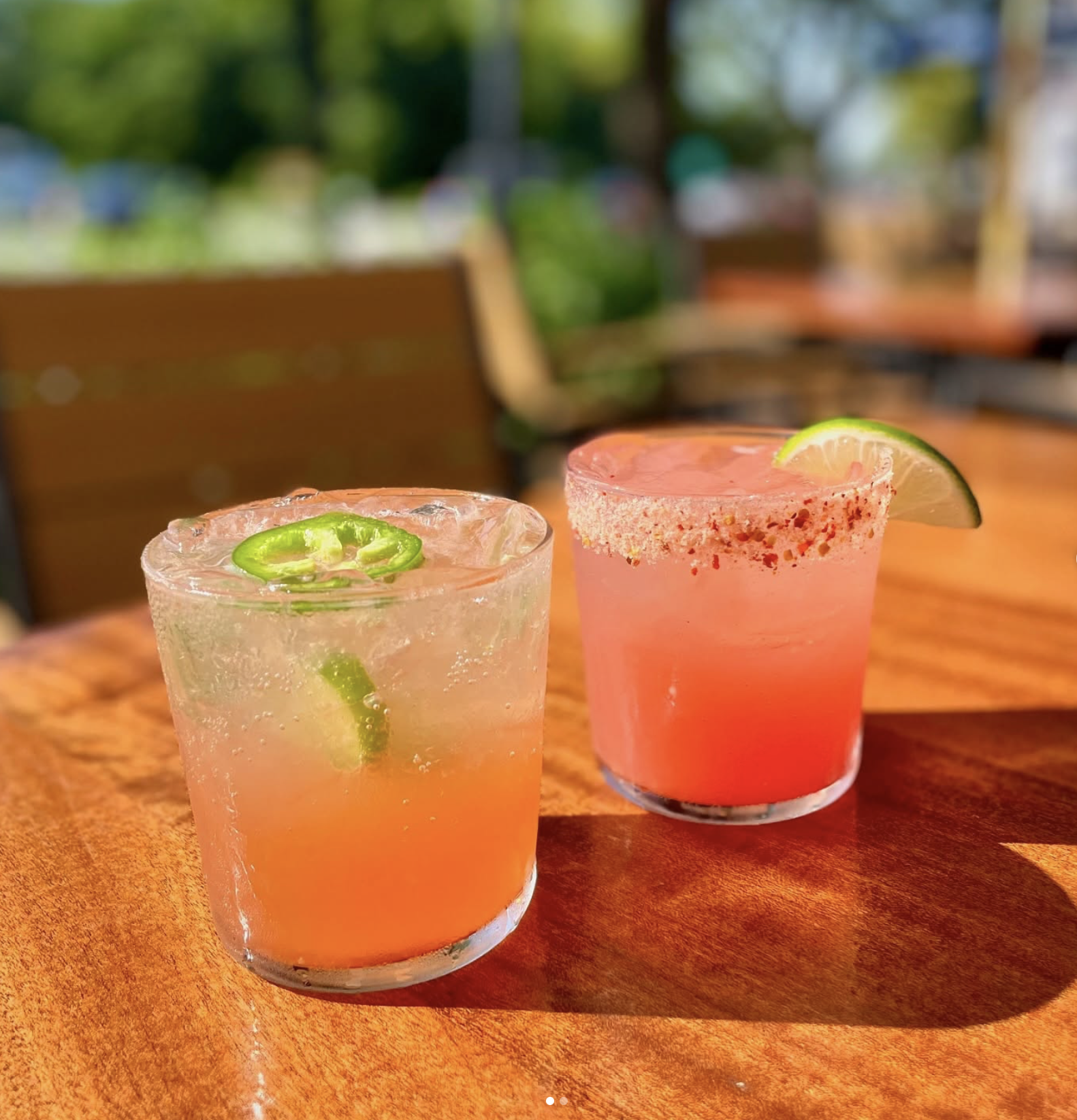 cocktails with jalepenos and lime wedges