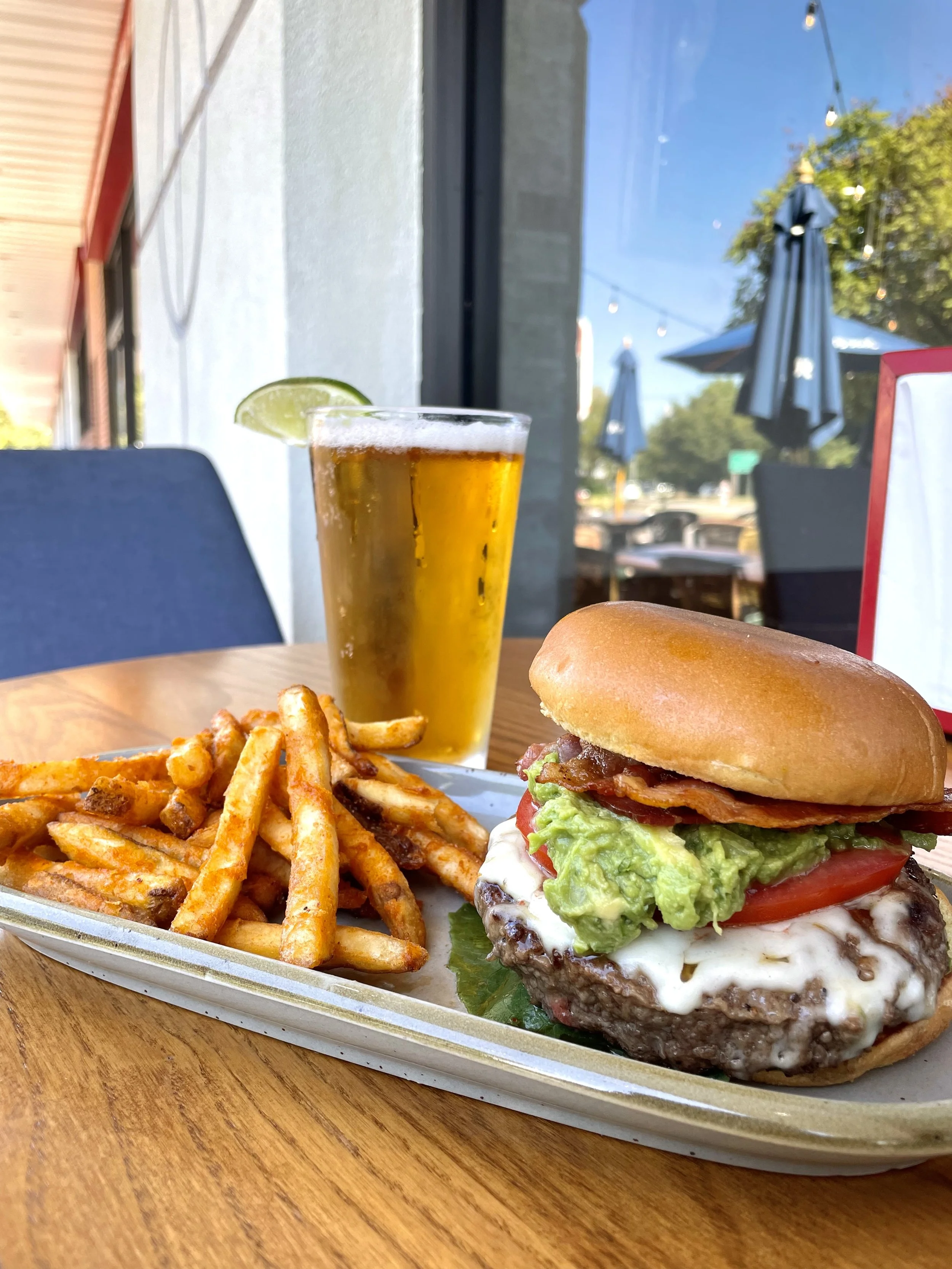 burger, beer, and fries outside