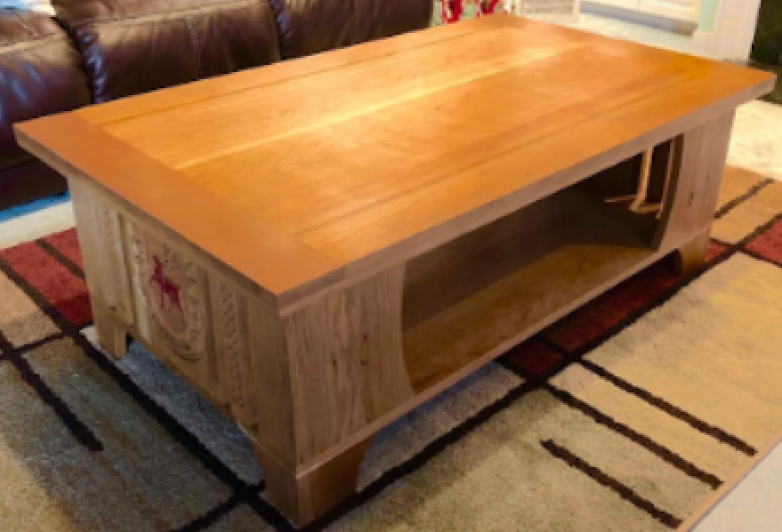 A wooden coffee table with a lower shelf, placed on a patterned area rug in a living room.