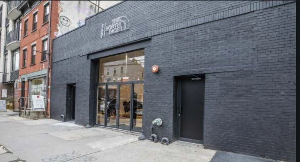gray brick storefront for The North Face