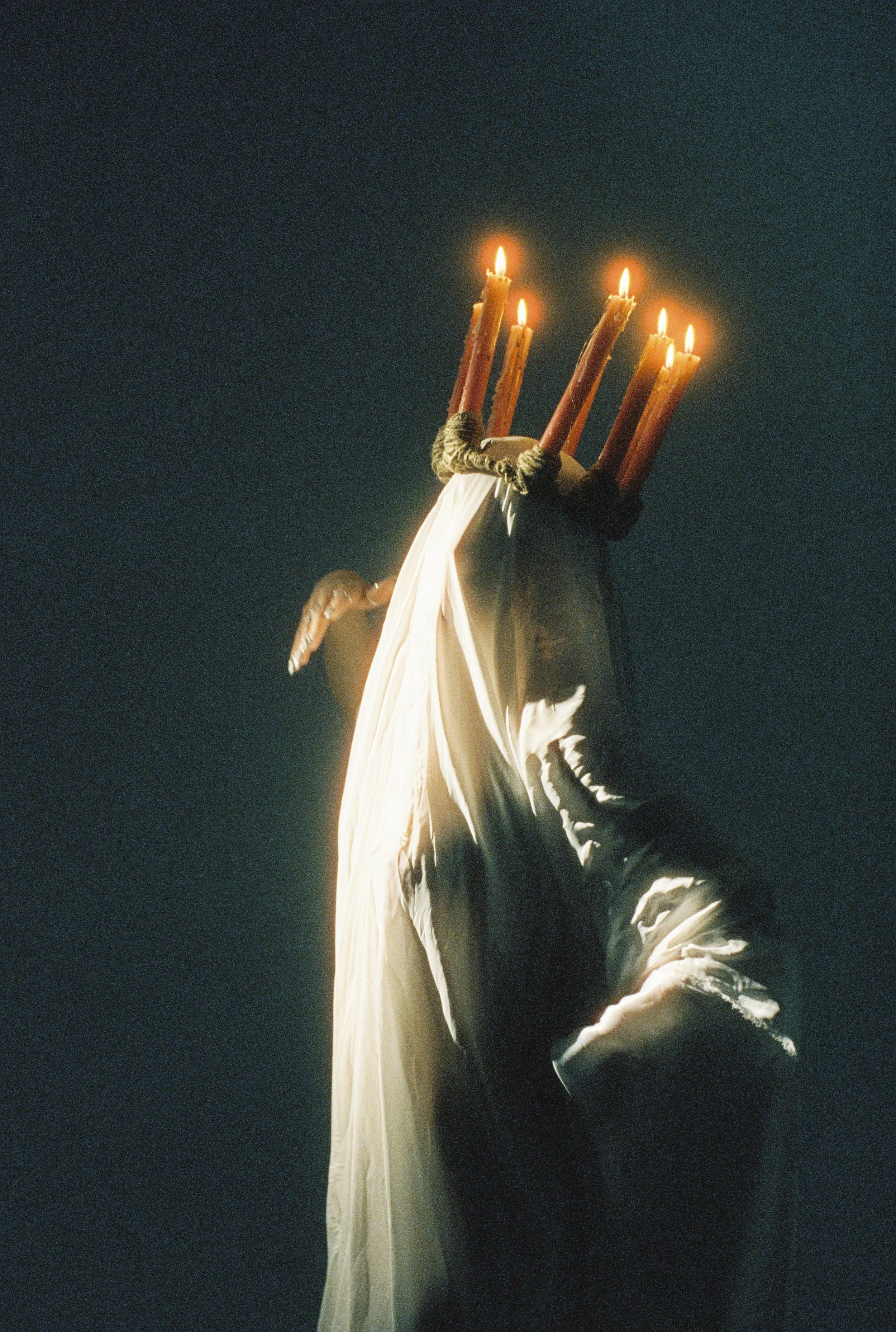 Statue of Liberty holding a bundle of lit candles instead of a torch.