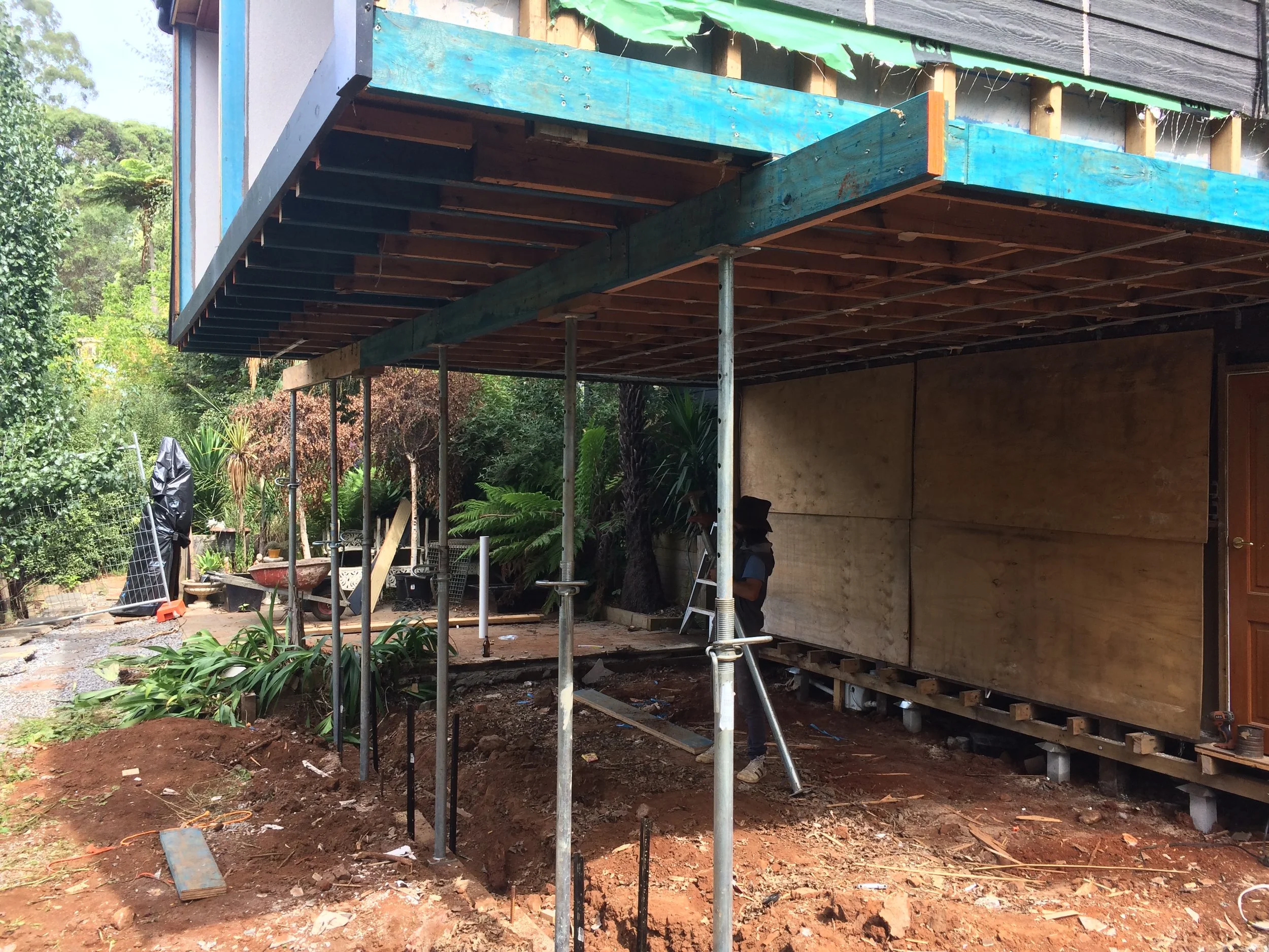 Oranssi technician working on a roof project