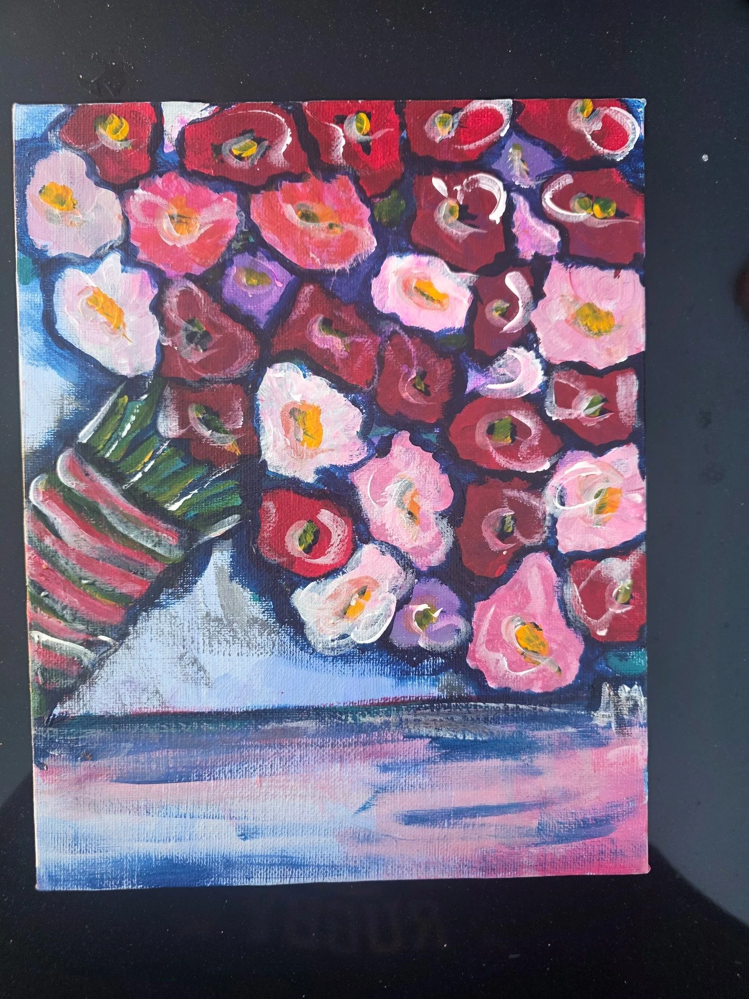 Painting of vibrant red, pink, purple, and white flowers with green leaves on a colorful background.