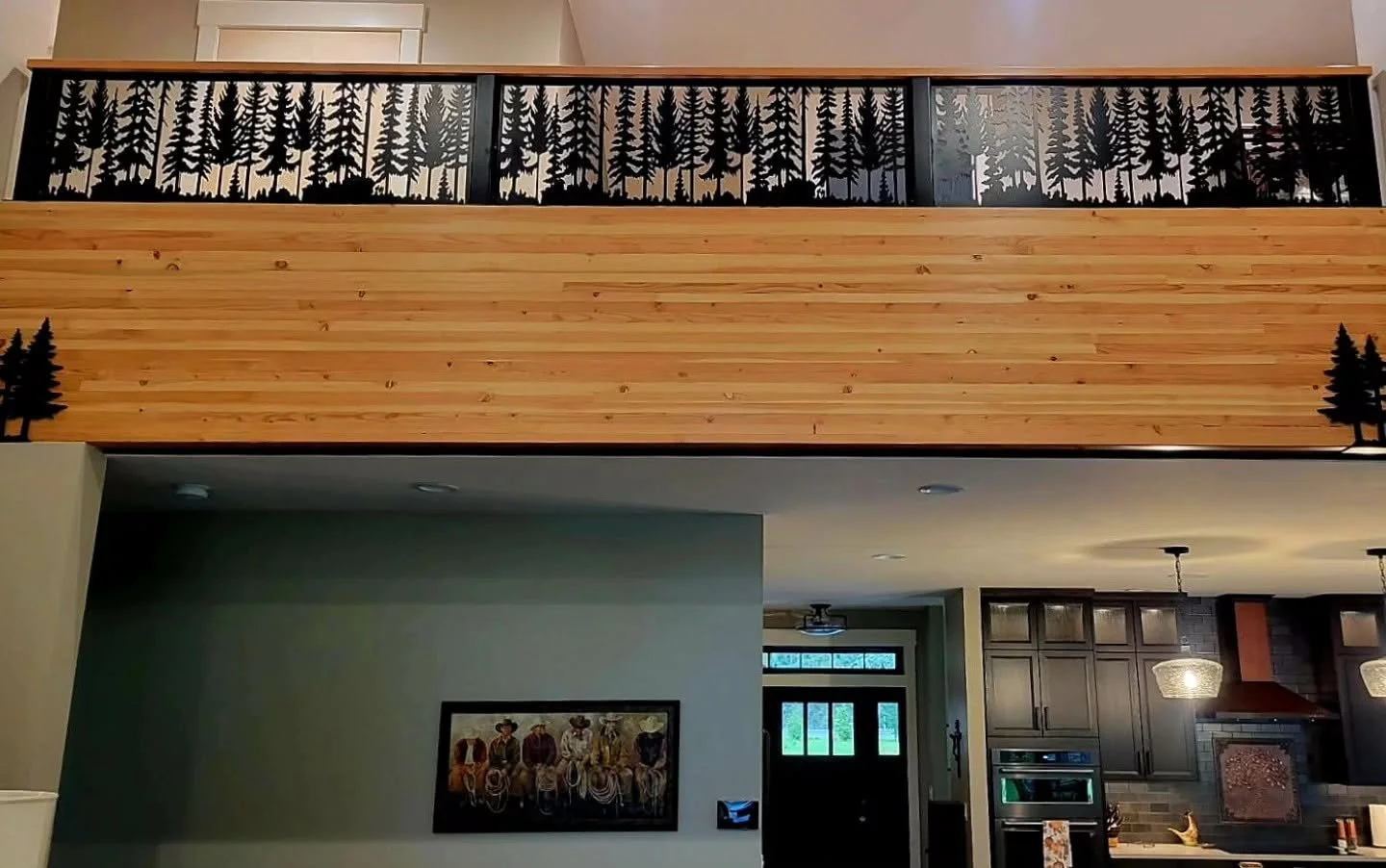 Indoor residential balcony railing featuring CNC-cut mountain forest scenery.