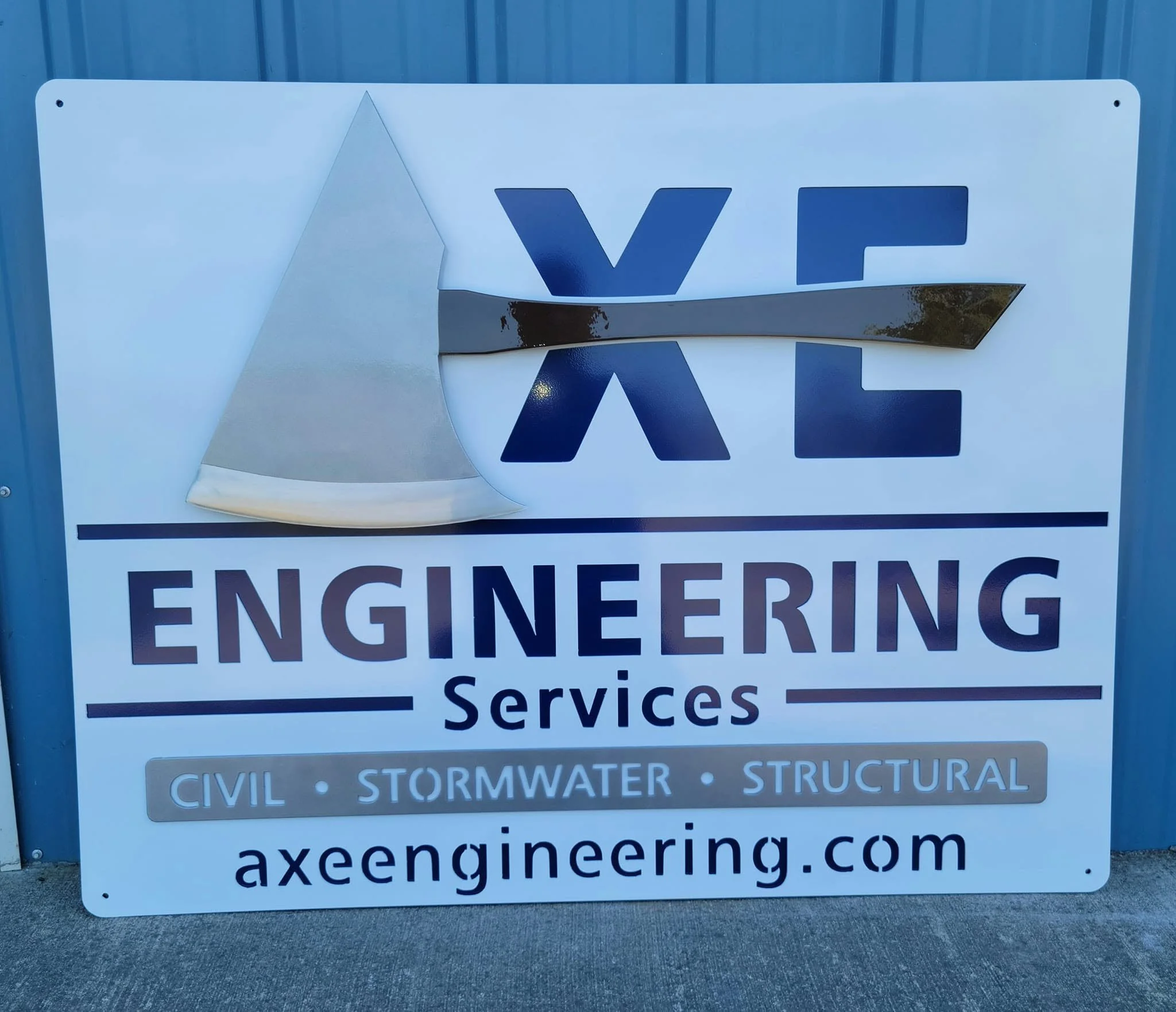 Custom CNC-cut metal business signage for Axe Engineering Services, featuring precision logo fabrication.