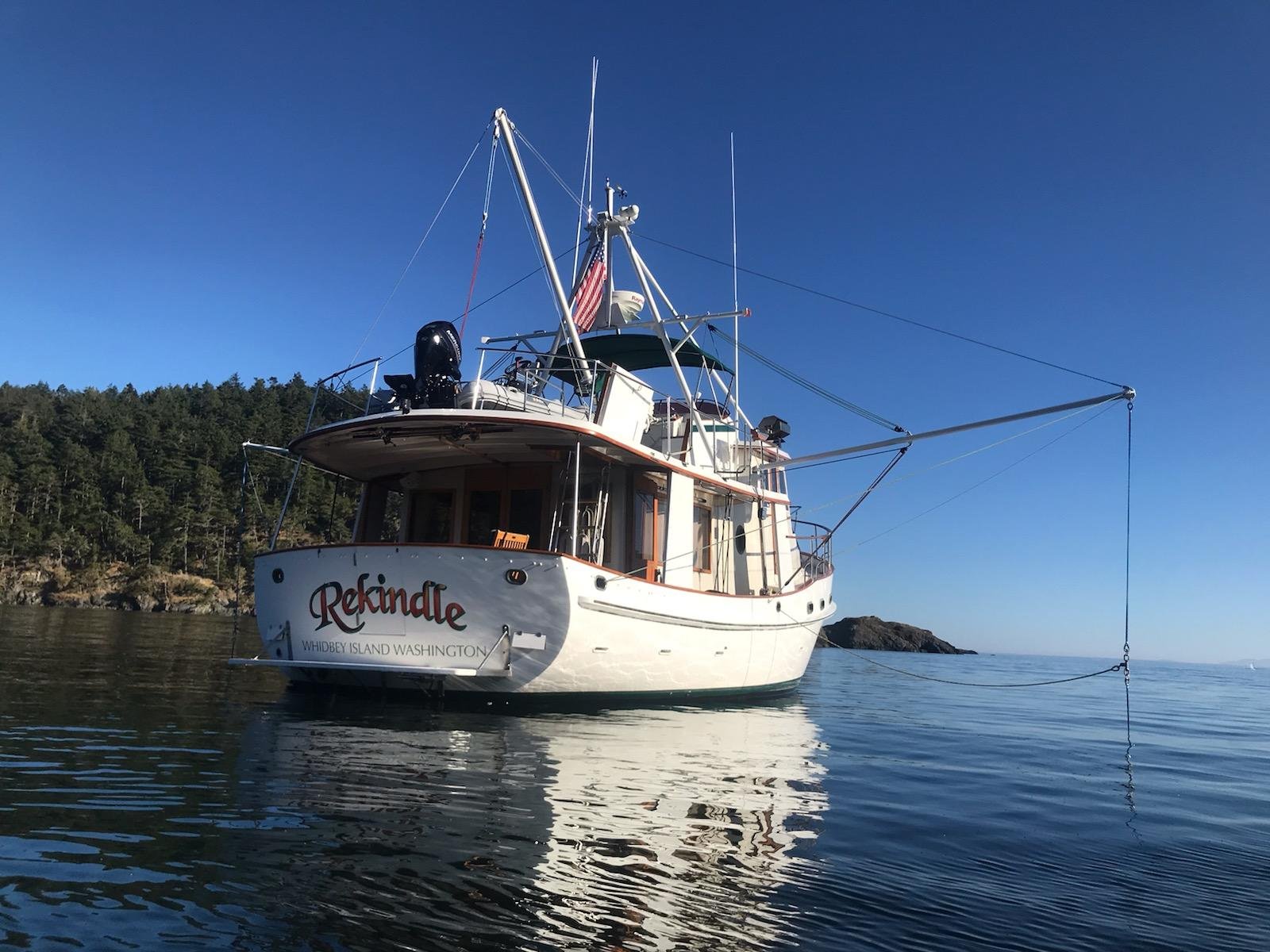 Custom marine metal fabrication and welding repair on the vessel 'Rekindle' docked in Whidbey Island, Washington.