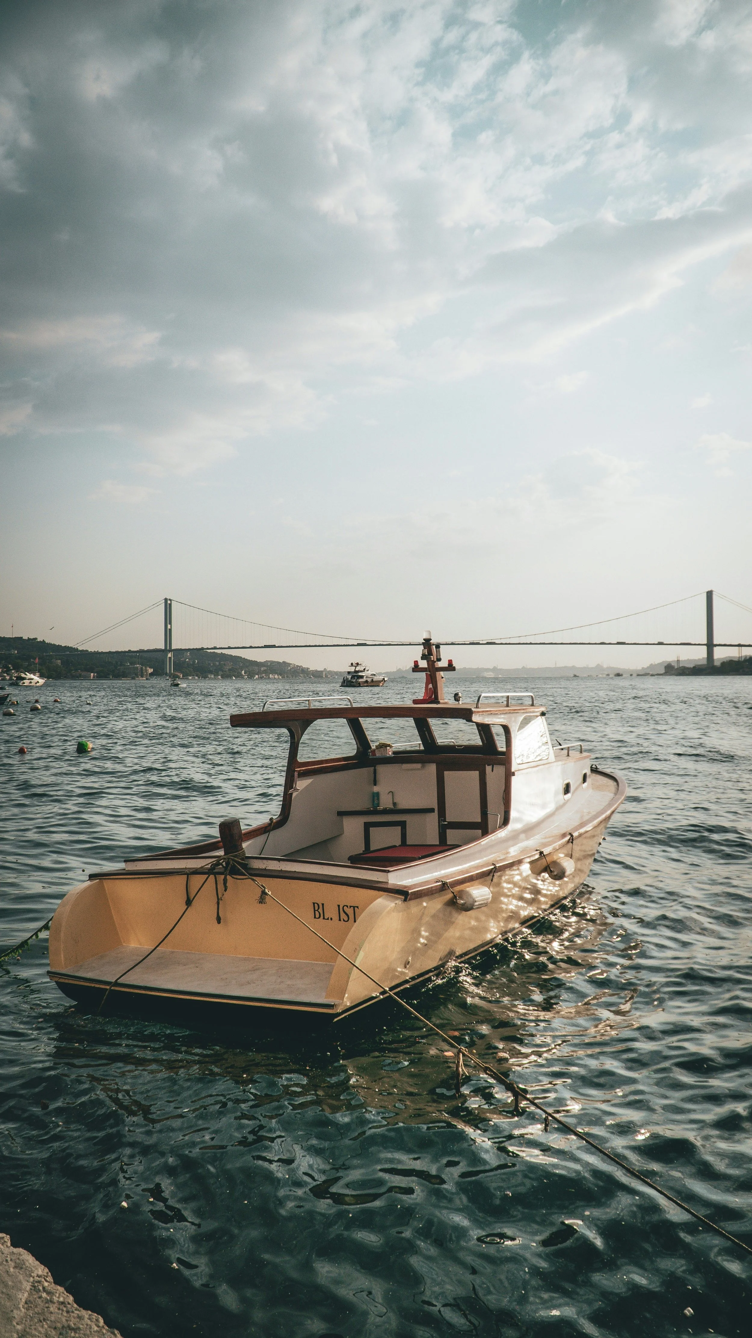 Custom marine-grade aluminum boat fabrication and metalwork repairs, featuring a finished vessel on the water.