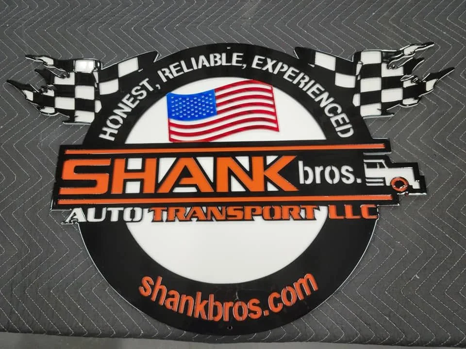 Custom-fabricated metal logo sign for Shank Bros. Auto Transport, featuring durable powder-coated finish.
