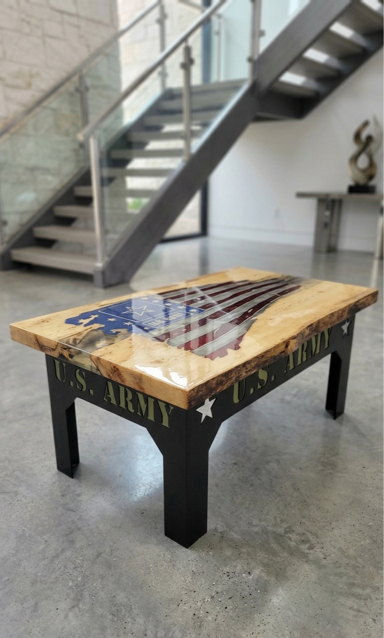 Custom CNC-cut metal and wood coffee table featuring a U.S. Army design and epoxy resin finish, showcasing high-end bespoke furniture fabrication.