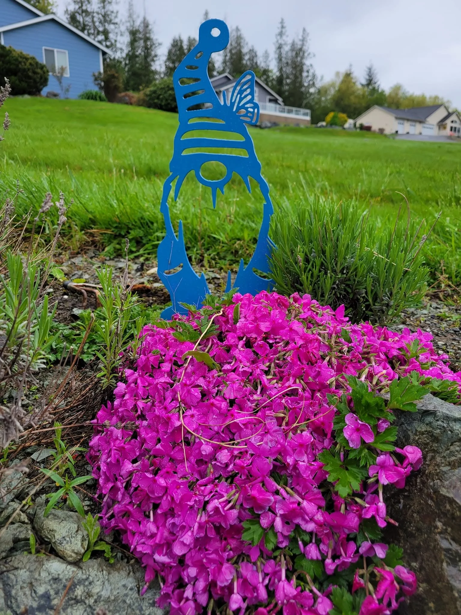 Custom-fabricated metal garden gnome yard stake featuring a durable blue powder-coated finish.