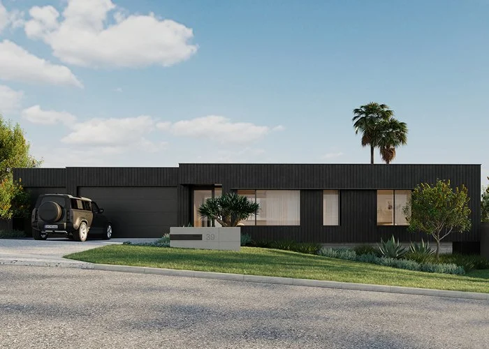 A modern, black, single-story house with a flat roof, large windows, a small front yard with bushes, and a black SUV parked in the driveway. A palm tree and a large flowering tree are in the yard, with a bright blue sky and a few clouds overhead.