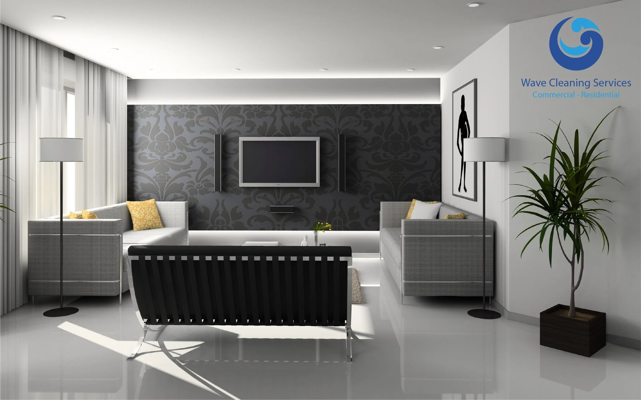 Modern living room with gray and white furniture, a wall-mounted TV, decorative pillows, plants, and a black and white painting. Sunlight streams through sheer white curtains.