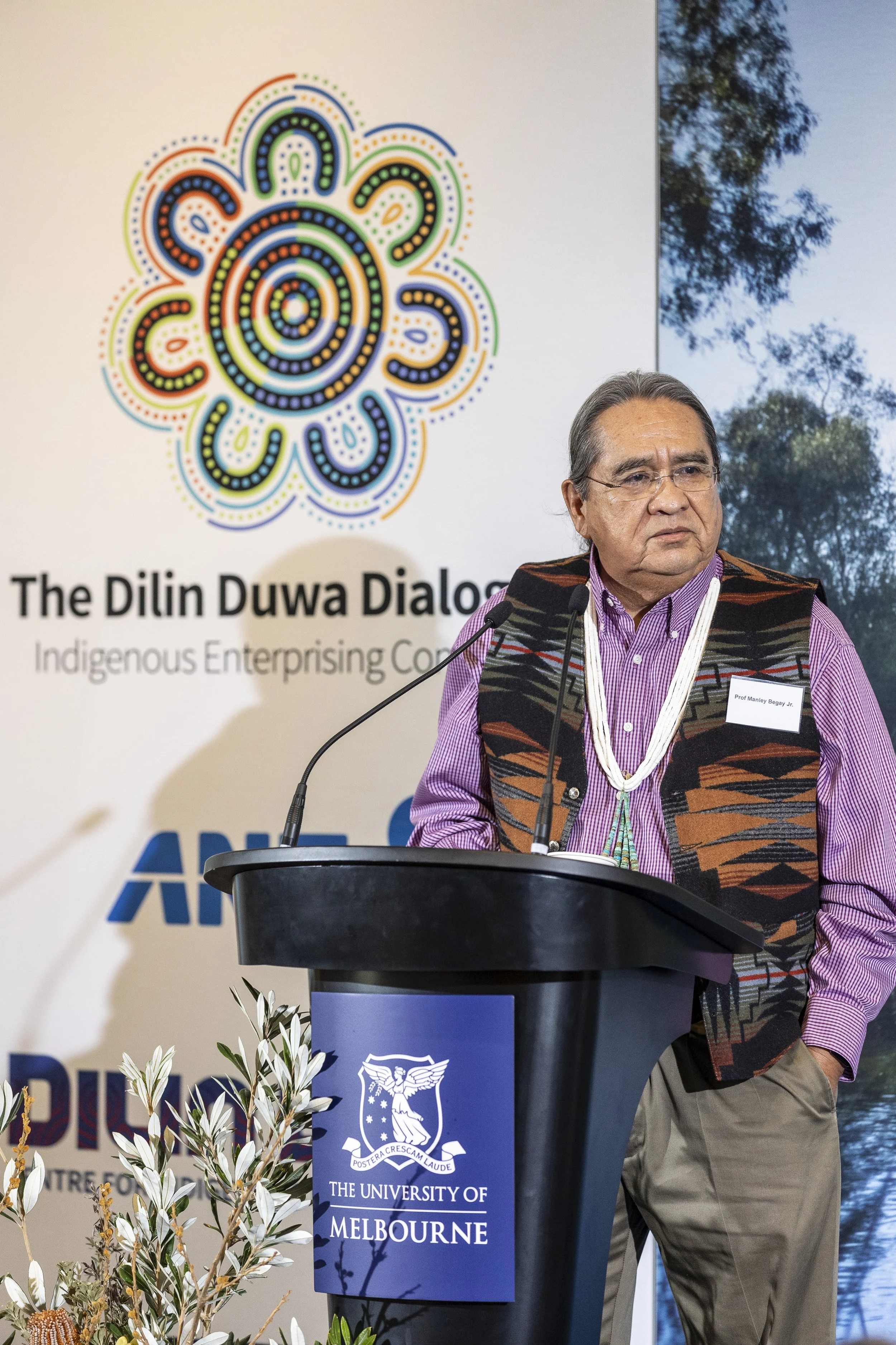 Manly Begay presenting at the Dilin Duwa Dialogues conference 2025