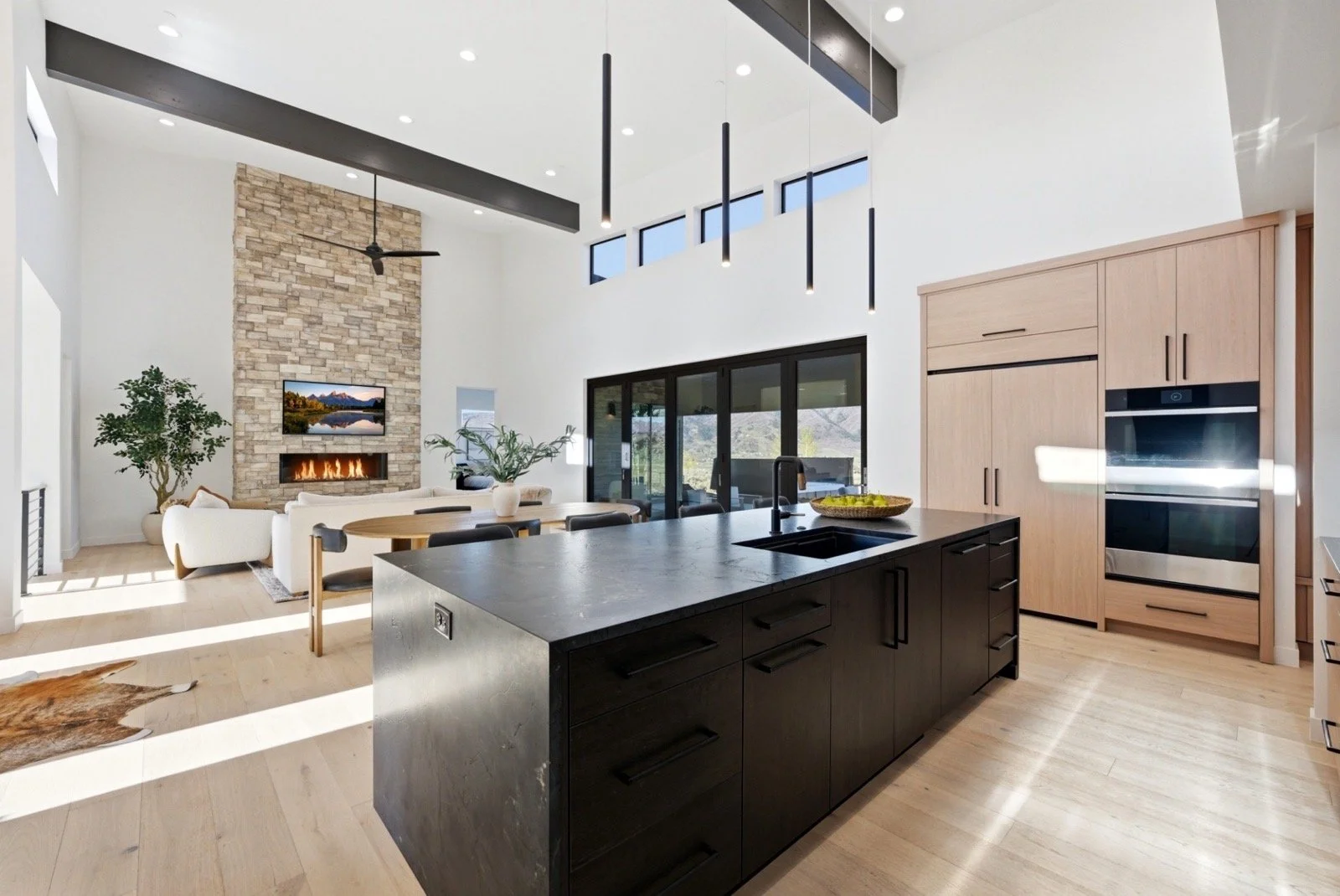 luxury-mountain-modern-kitchen-stone-fireplace-interior.jpeg