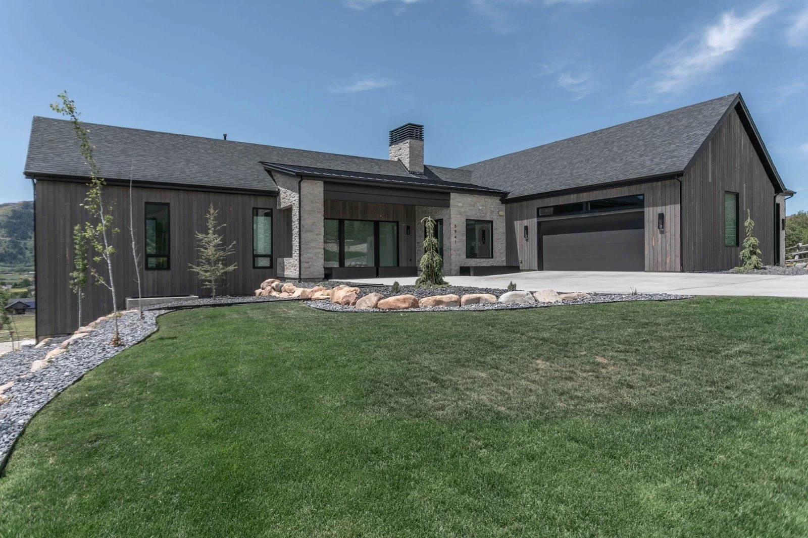 mountain-modern-custom-home-utah-front-entry-stone-wood-detail-08-gallery_1600.jpeg