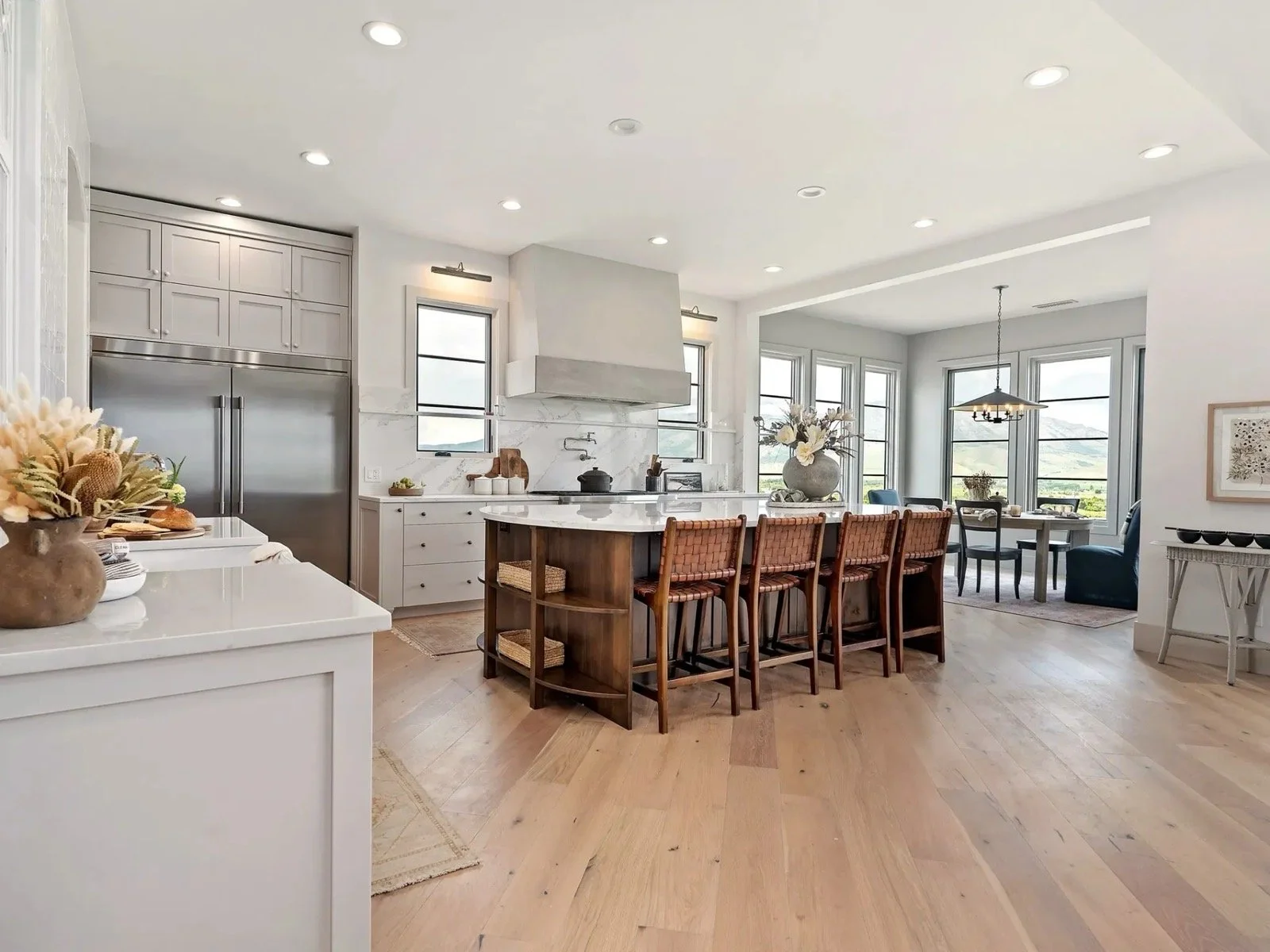 transitional-mountain-home-open-concept-kitchen-dining-valley-view-04.jpeg