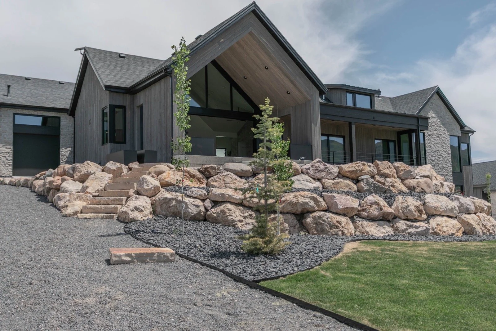 mountain-modern-custom-home-utah-rear-exterior-stone-wood-facade-10-gallery_1600.jpeg