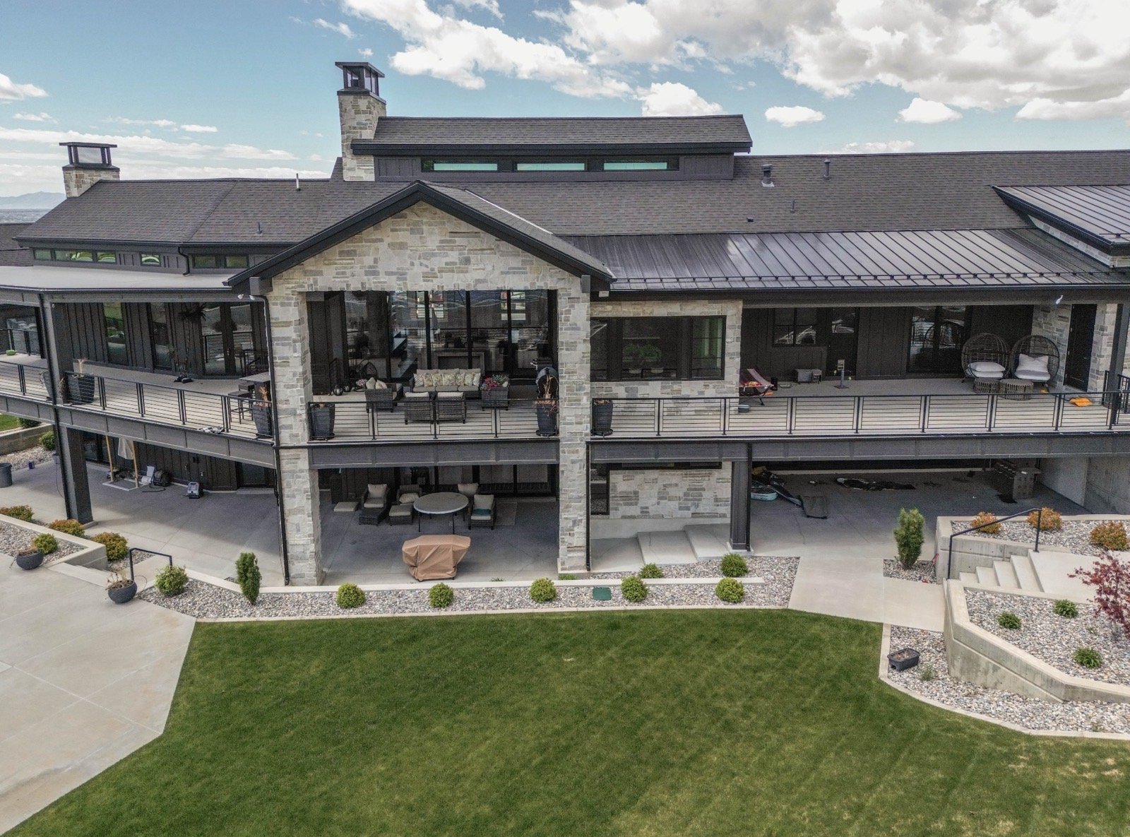 mountain-modern-custom-home-utah-aerial-rear-pool-sports-court-08-gallery_1600.jpeg
