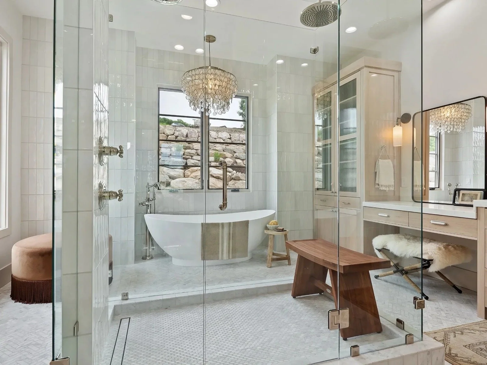 transitional-mountain-home-luxury-primary-bath-glass-shower-freestanding-tub-01.jpeg