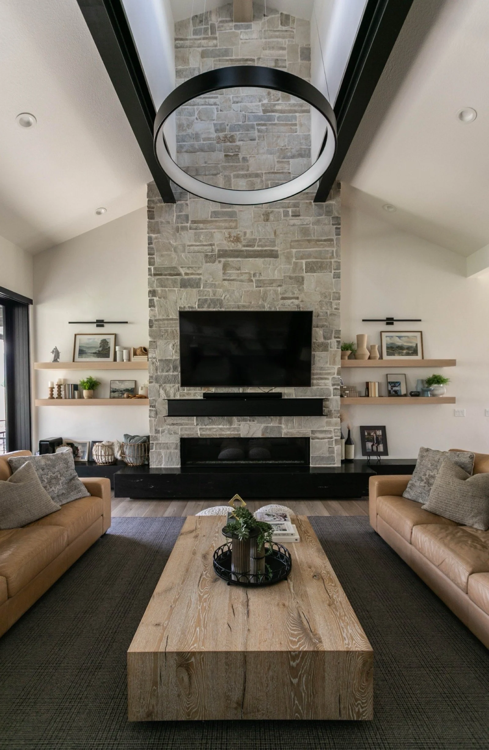 mountain-modern-custom-home-utah-stone-fireplace-circle-light-15-gallery_1600.jpeg