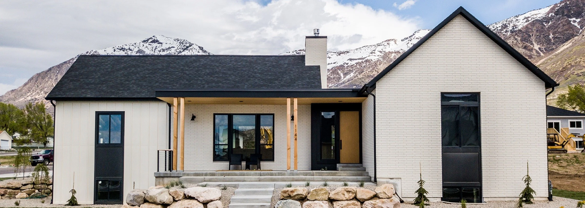 modern-transitional-farmhouse-white-brick-front-exterior-mountain-view-04.jpeg