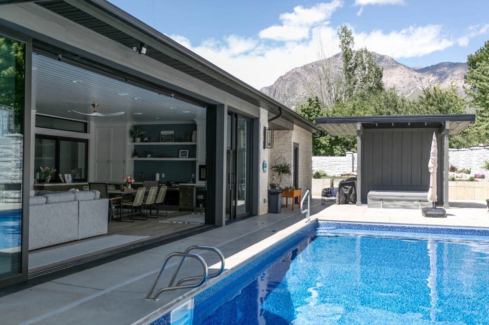 modern-farmhouse-custom-home-utah-pool-outdoor-living-room-20-gallery_1600.jpeg