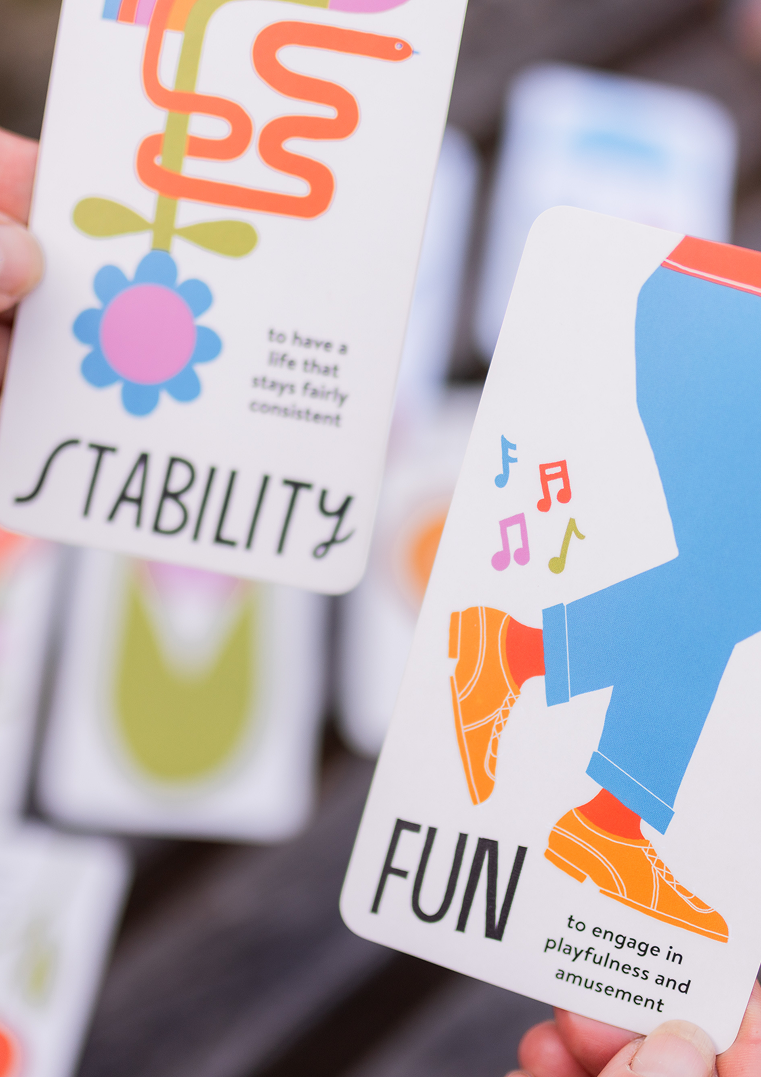 Cards with illustrations and text emphasizing qualities: one card shows a flower and a snake with the word 'Stability' and a phrase about life consistency, another card depicts a person's legs with colorful musical notes and the word 'Fun' about engagement in playfulness and amusement.