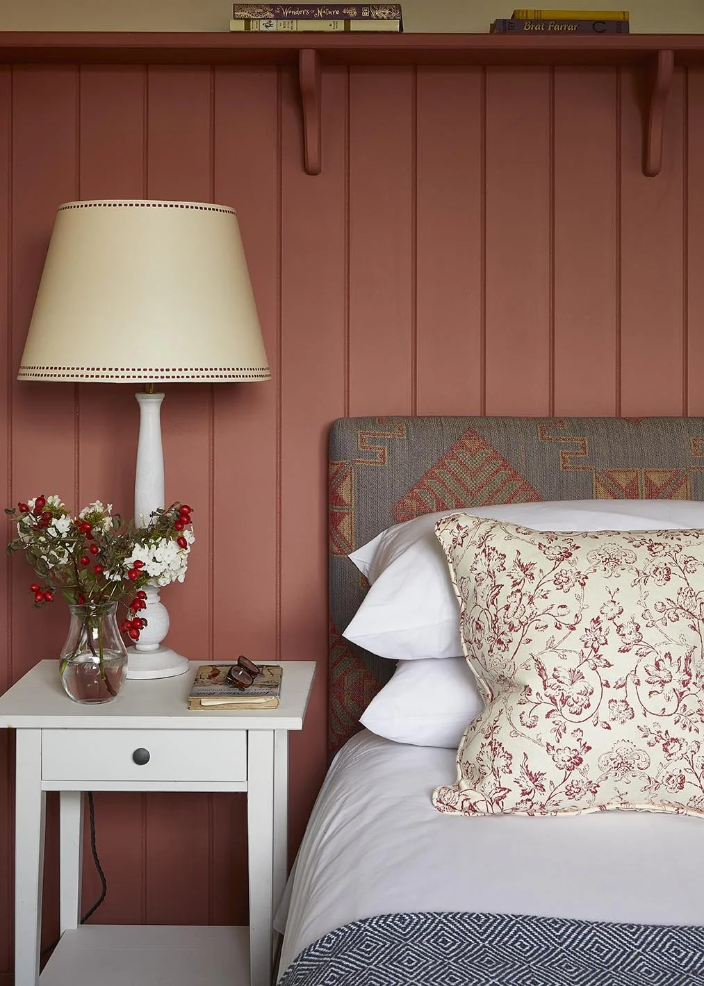 A richly toned double bedroom in The Loose Box