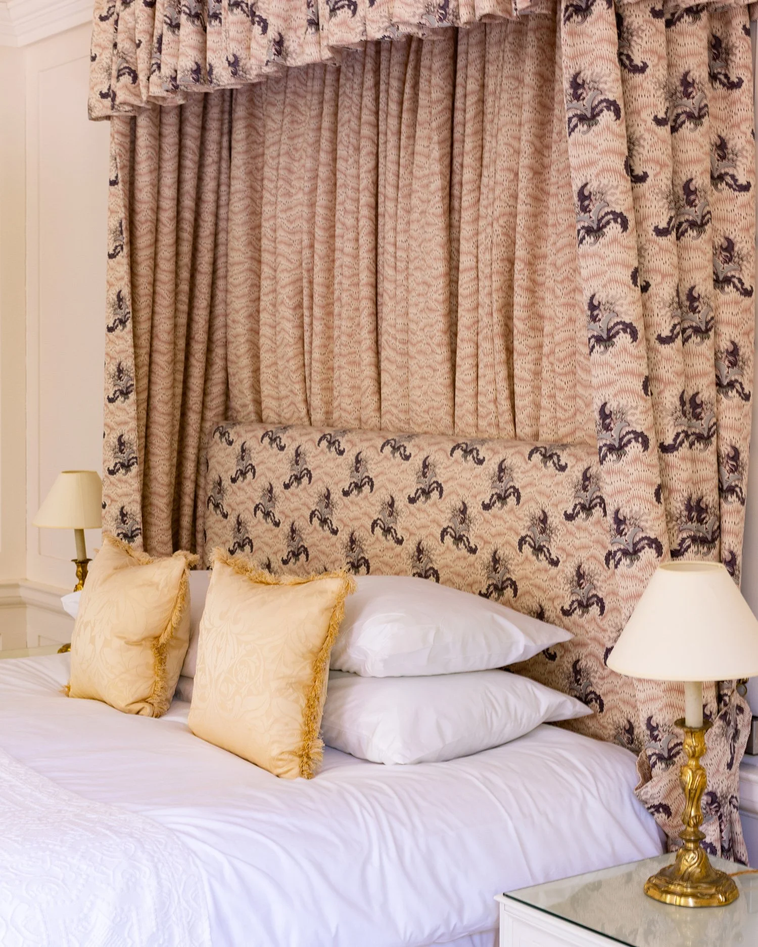 Detail of the tester bed covered in fabrics by Flora Soames in Meadow House