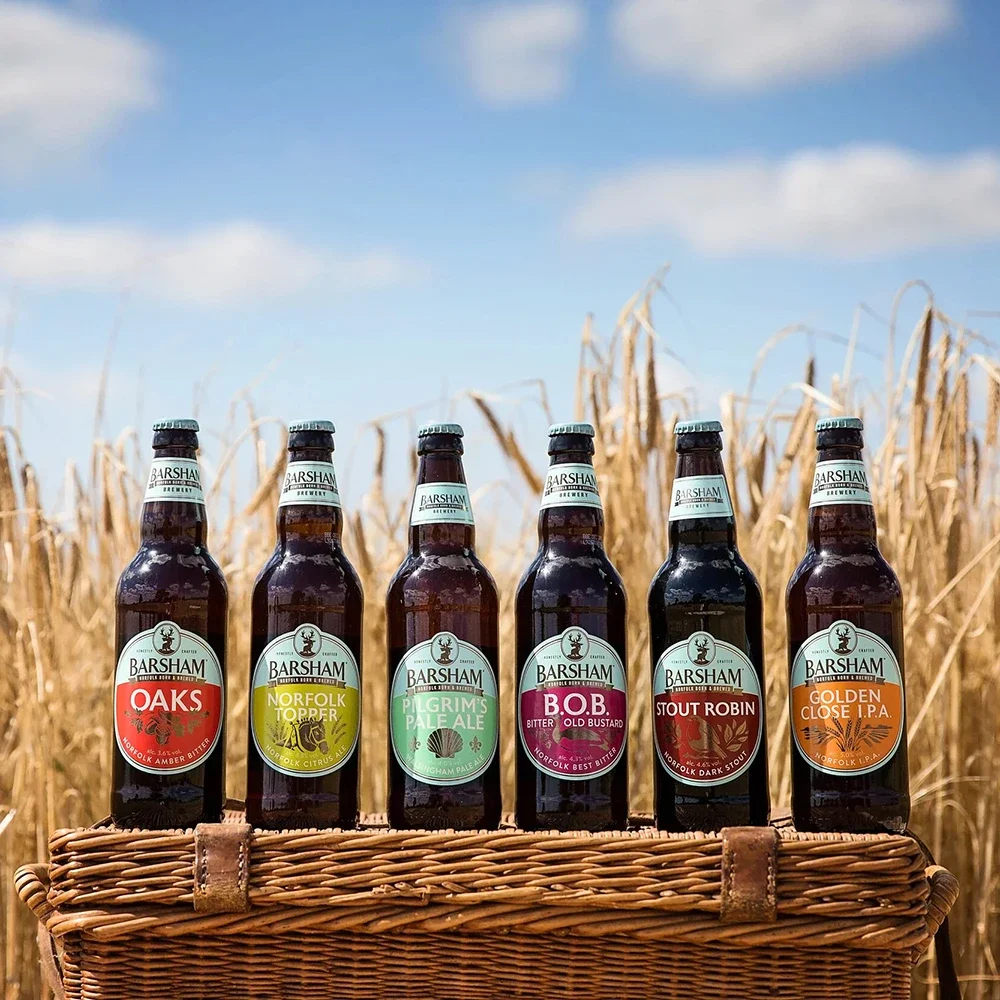 Beer from Barsham Brewery's collection in one of the fields where the malting barley is grown