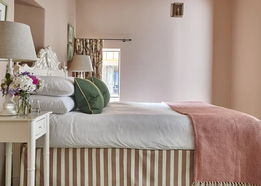 An elegant double bedroom in Long Meadow with Flora Soames fabrics