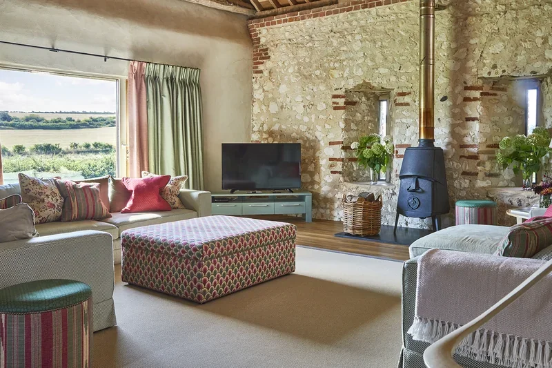 The vaulted Living Room in Great East with views out of the huge window across the Stiffkey River Valley