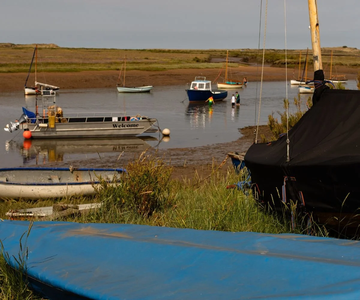 Boats at Burnham Overy Staithe, one of North Norfolk's hidden gems, just a short drive from the Barsham Estate