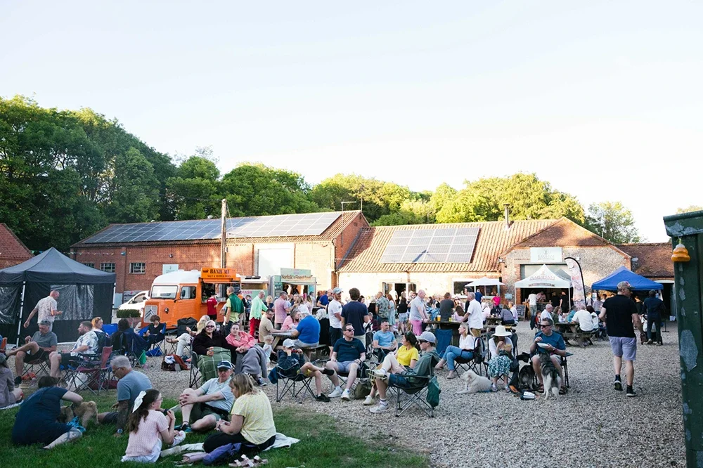 Visitors enjoying food trucks and live music at Street Food Friday