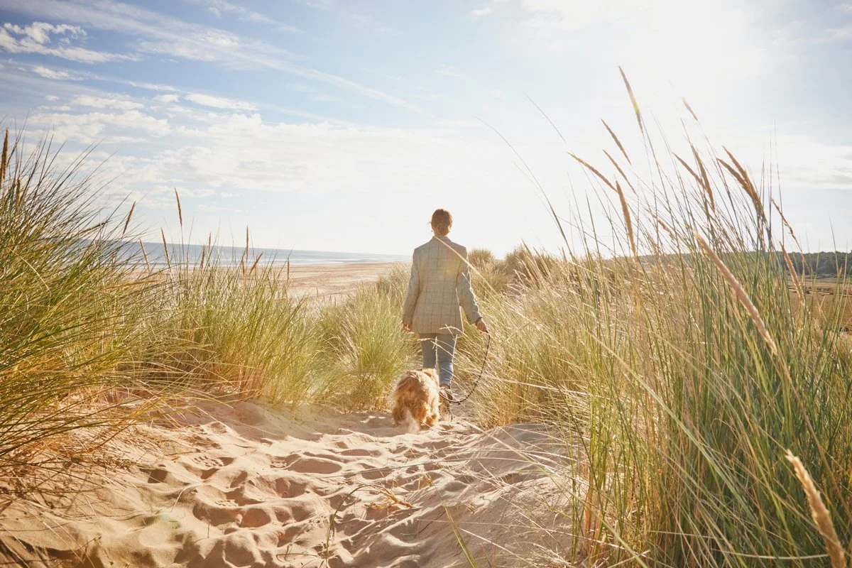 Walking through the dunes towards the sand at Holkham Beach in North Norfolk, a short drive from the Barsham Estate