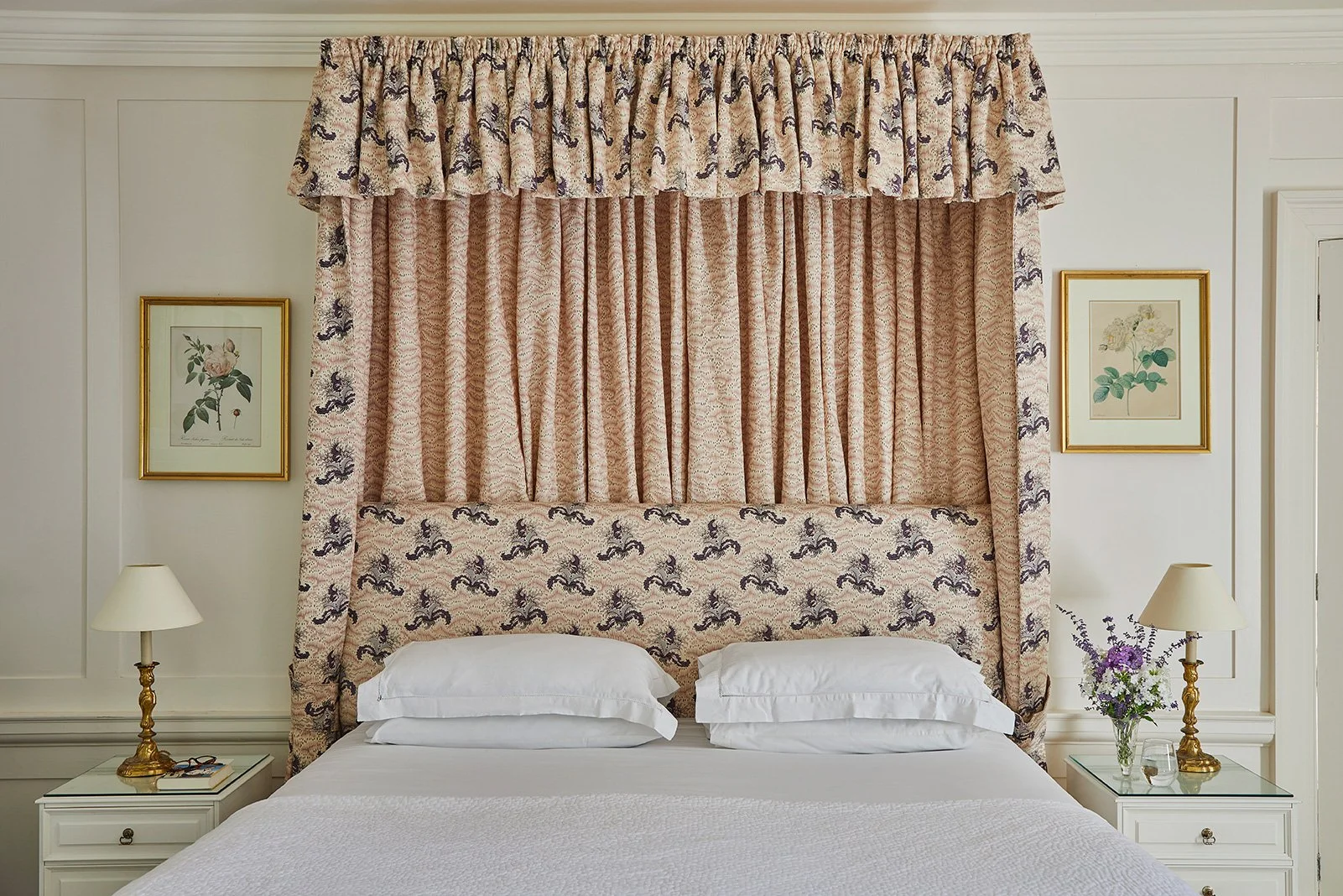 A tester bed in one of the light-filled bedrooms in Meadow House