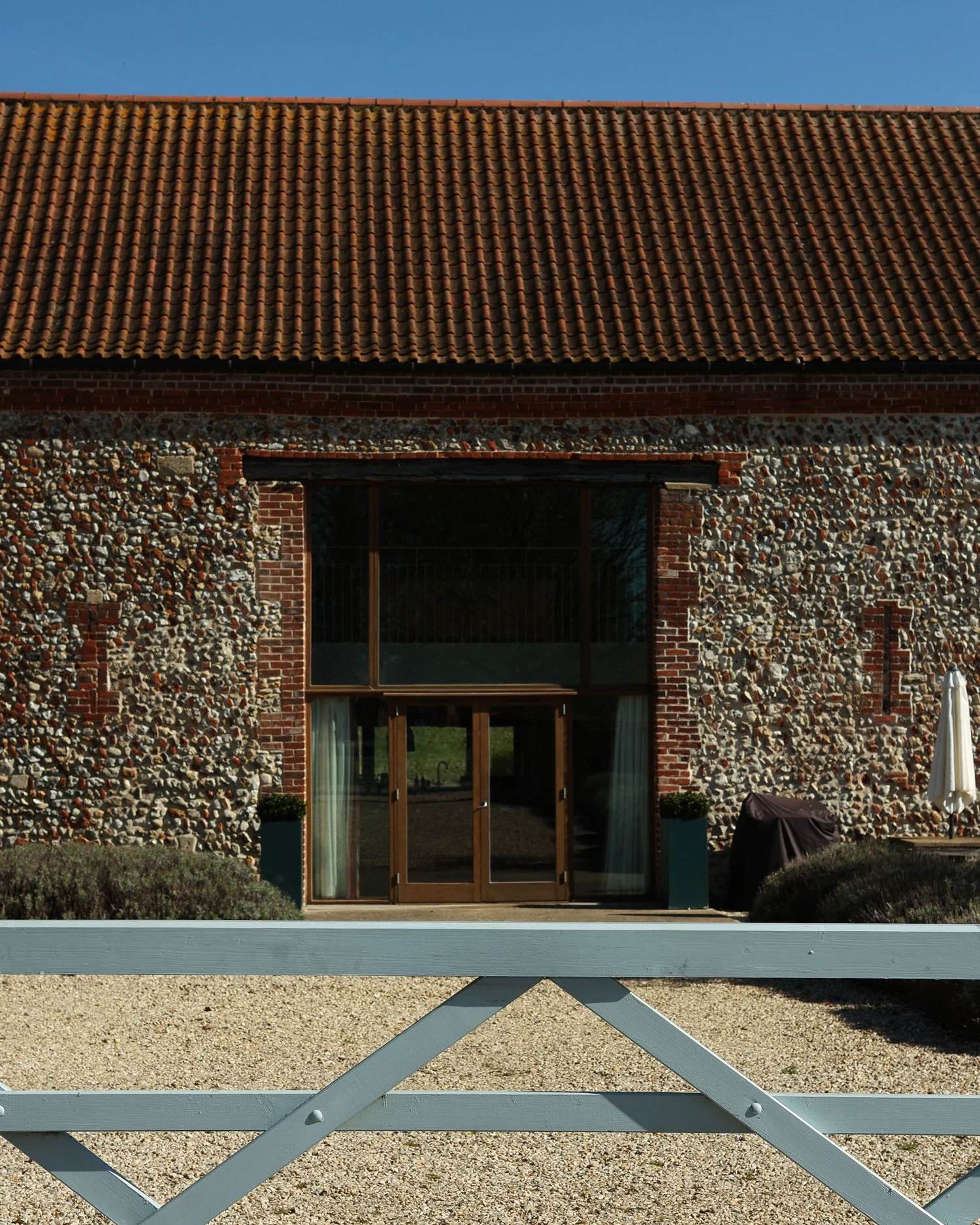 The exterior of High Barsham looking over the five bar gate