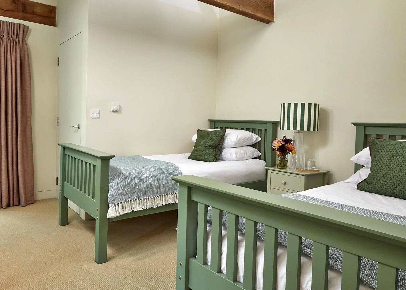 A colourful twin bedroom in Great East