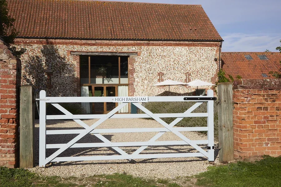 Exterior of High Barsham looking through the five bar gate to the garden