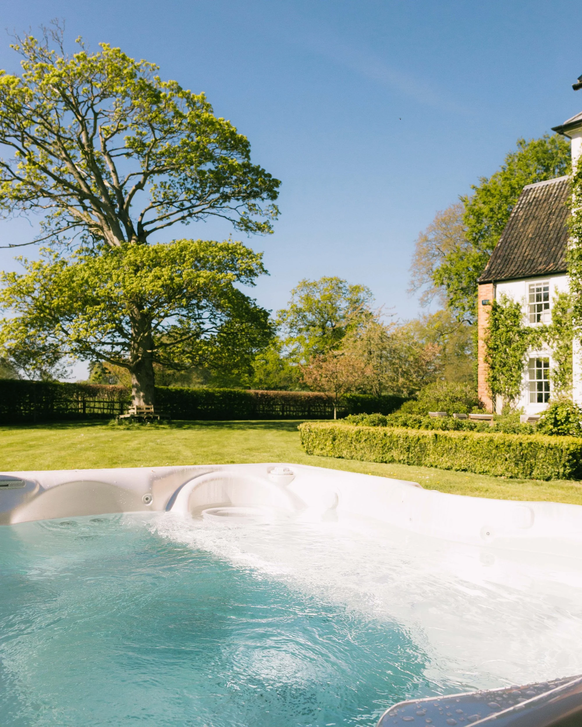 View from the hot tub over the rose garden at Meadow House