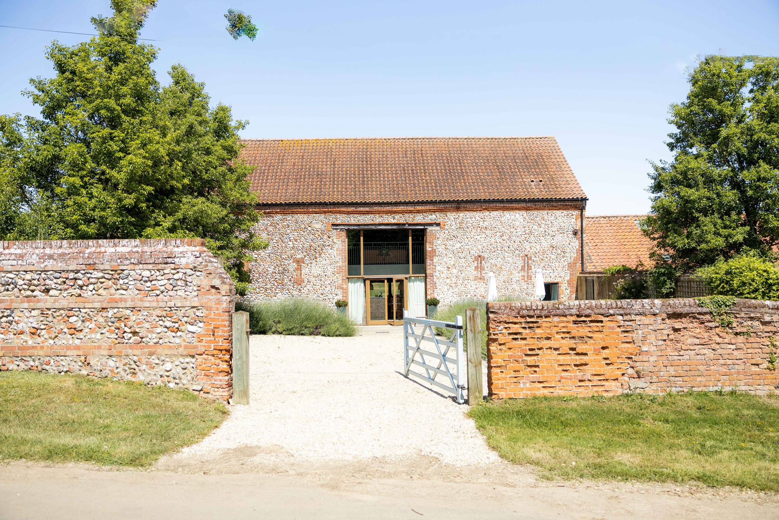The exterior of one of our large holiday lets, High Barsham, a converted barn in the heart of the Norfolk countryside