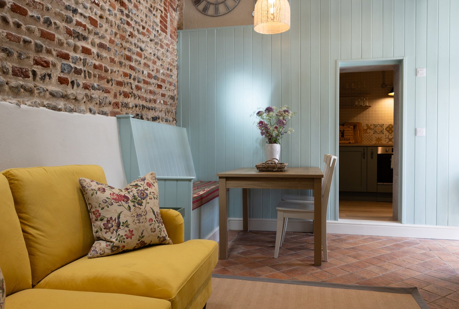 The carefully designed open-plan living and dining area in Little Sandford, looking towards the fully-equipped kitchen