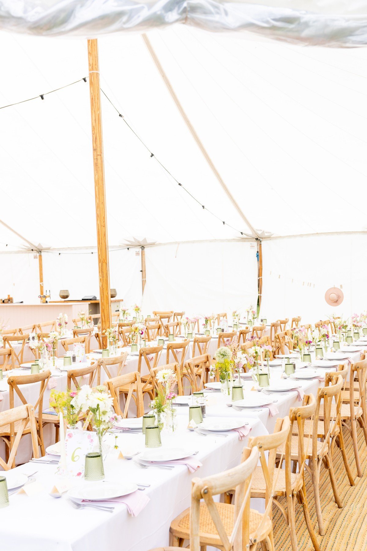 A beautiful traditional marquee ready for guests during a wedding at Meadow House on the West Barsham Estate