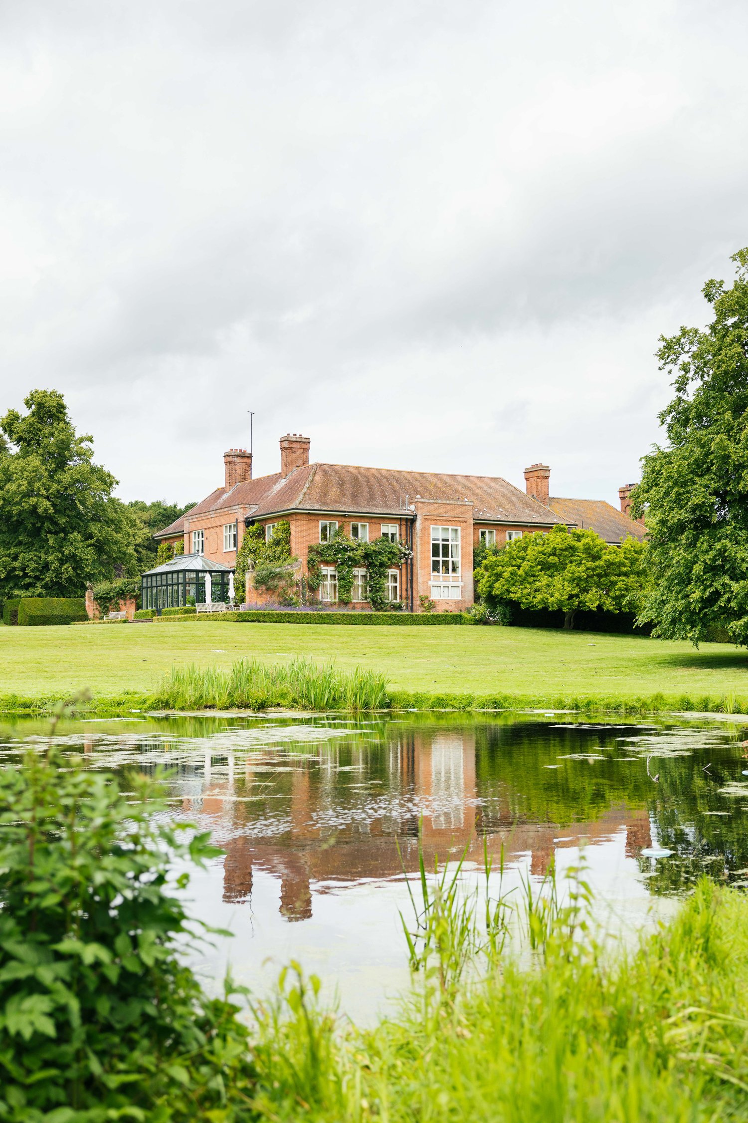 Exterior of West Barsham Hall from the lake
