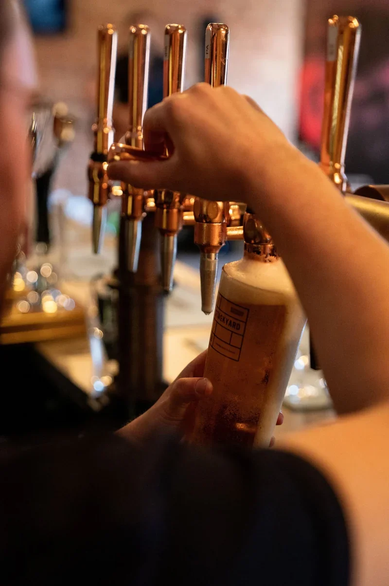 Pulling pints in The Taproom