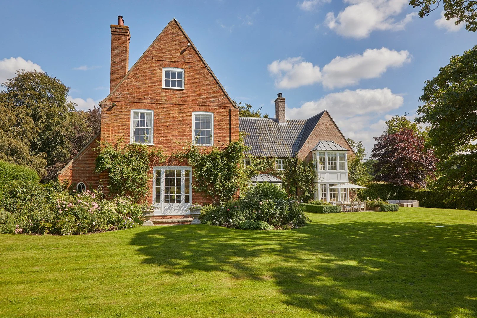 Barsham's ancient manor house, Meadow House viewed from the rose-filled, wraparound garden