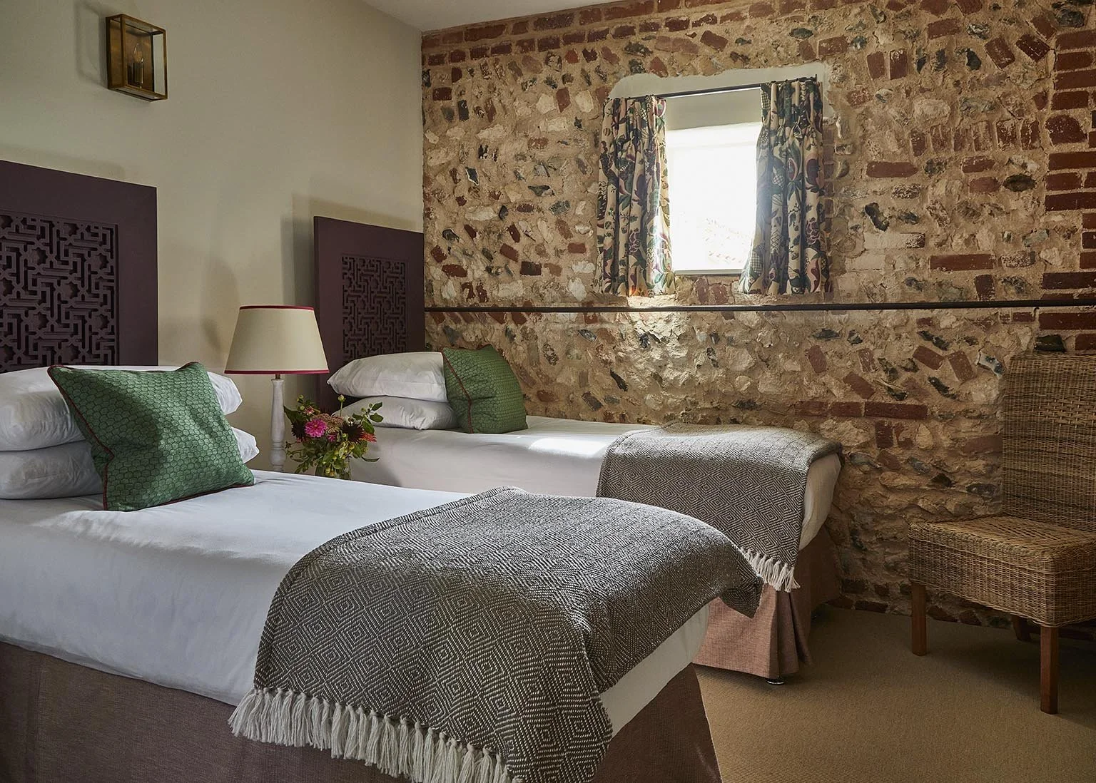 A cosy twin bedroom in High Barsham with exposed brickwork