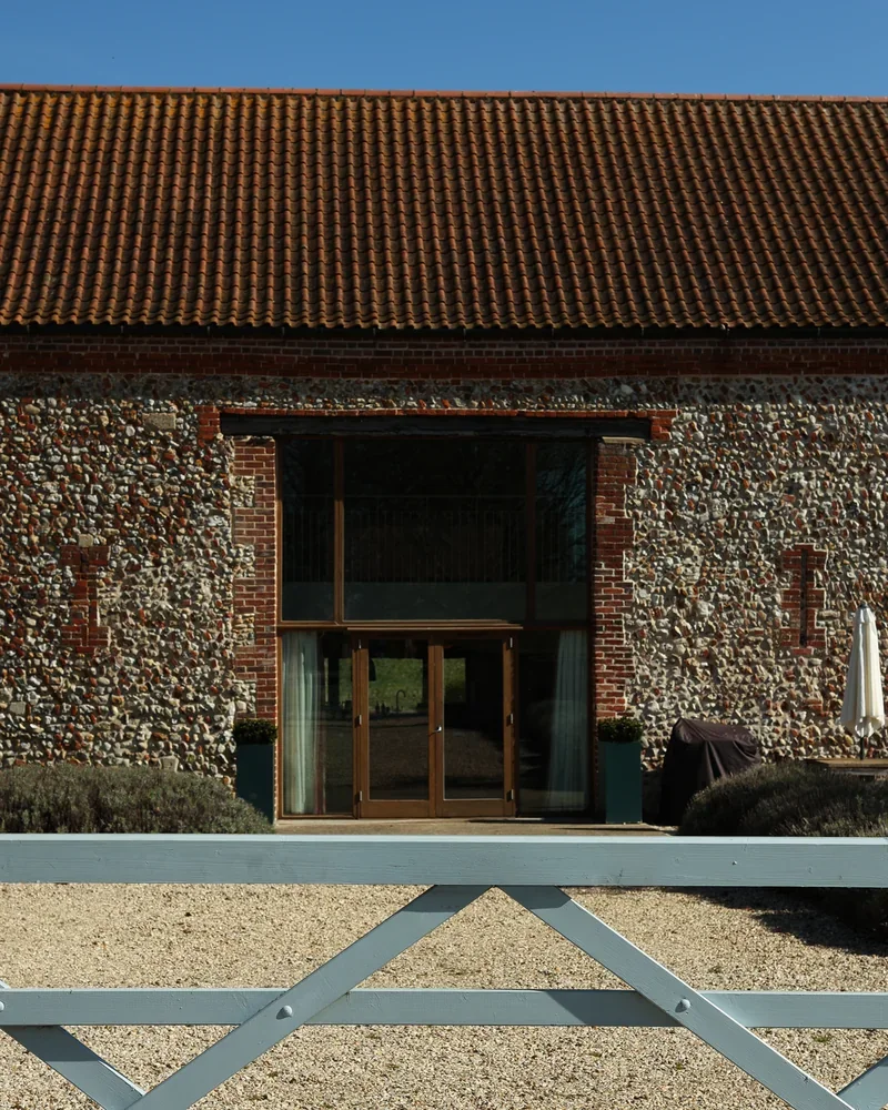 The exterior of High Barsham looking over the five bar gate